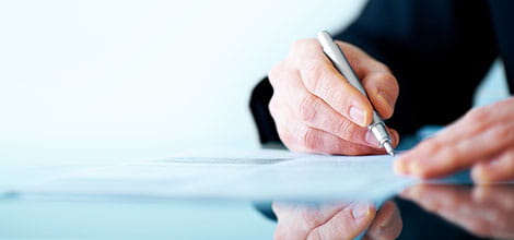 Close up of person holding a pen